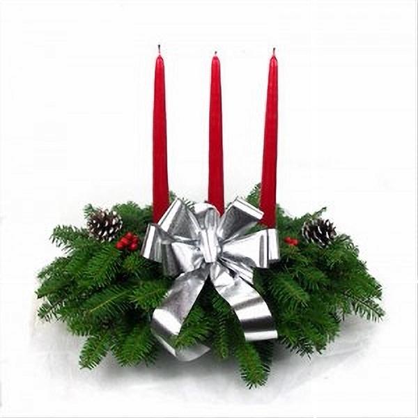 Silver Centerpiece featuring fresh Balsam greenery with silver ornaments, frosted pinecones, silver berries, and a white candle, perfect for adding winter elegance to holiday decor or for corporate gift-giving.