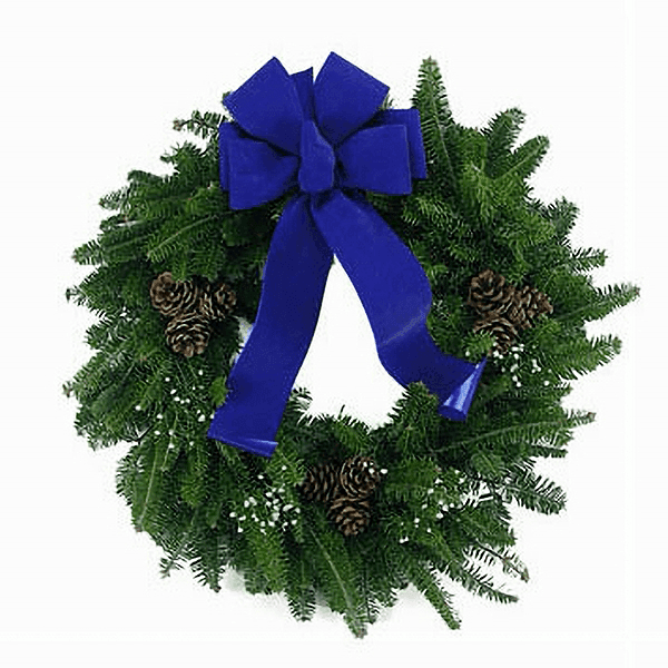 Blue Country Wreath with fresh Balsam greenery, 6-loop blue bow, and triple pinecones.