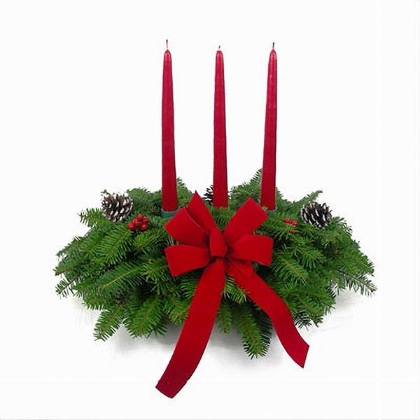 Red Candle Centerpiece with Balsam greenery, red berries, and a red candle.