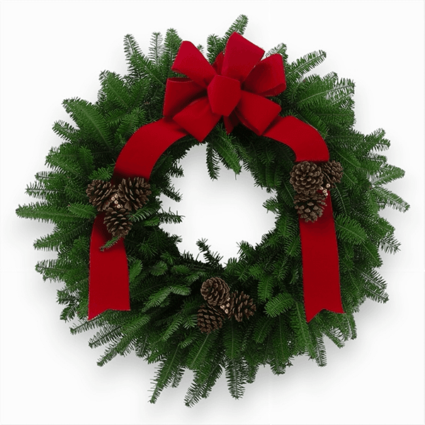 Saint Nick Wreath with fresh Balsam greenery, red berries, and a red ribbon.